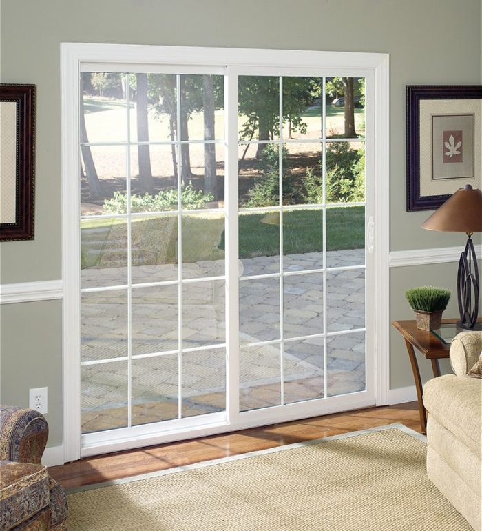 Sliding glass patio door with 30 individual squares of glass panels divided by white trim
